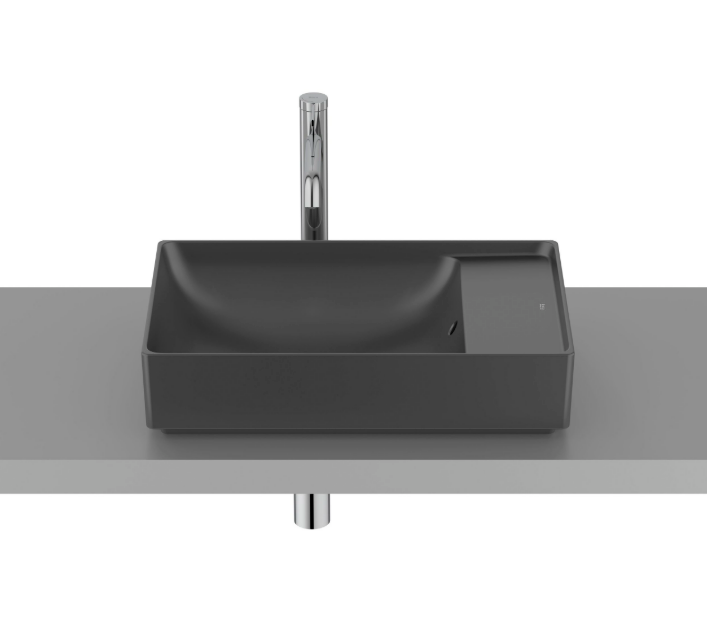 Екранна снимка 2026-07-26 172722 - Мебели за баня и душкабини Rectangular dark gray bathroom sink on a gray countertop with a tall chrome faucet and exposed plumbing beneath.