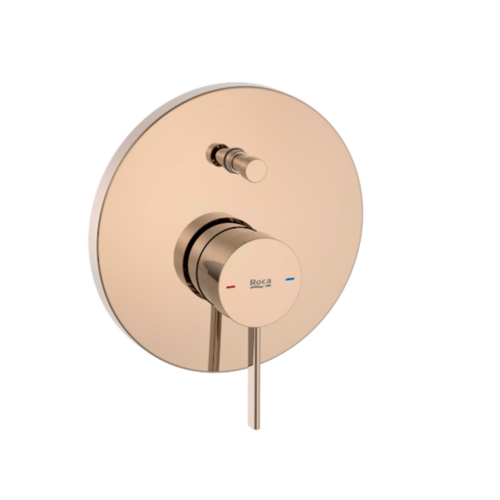 Rose gold wall-mounted shower control with circular plate and single lever, red and blue temperature markers, labeled 'Roca'