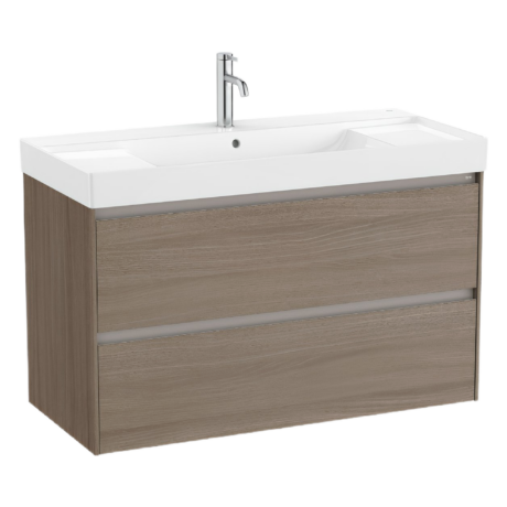 White bathroom vanity with an integrated sink, tall chrome faucet, and woodgrain cabinet base.