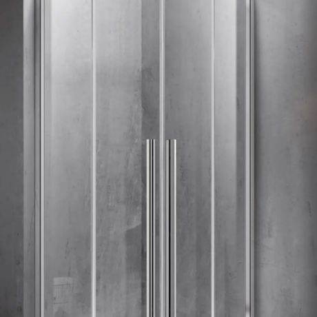 Chrome-framed glass corner shower enclosure with two vertical door handles on a white tray in a modern bathroom setting.