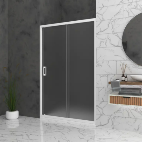 Modern bathroom with a frosted glass shower door, white marble walls and floor, and a round mirror above a floating vanity.