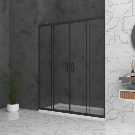 Glass shower enclosure with a black frame in a marble-tiled bathroom, with a potted plant nearby.