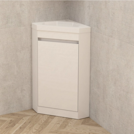 White corner bathroom vanity with integrated sink and closed cabinet door beneath, placed against a textured wall and wooden floor.