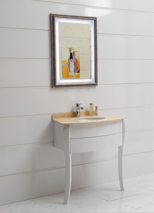 White bathroom vanity with a beige countertop, chrome faucet, and two bottles, against a paneled wall with a framed abstract painting above.