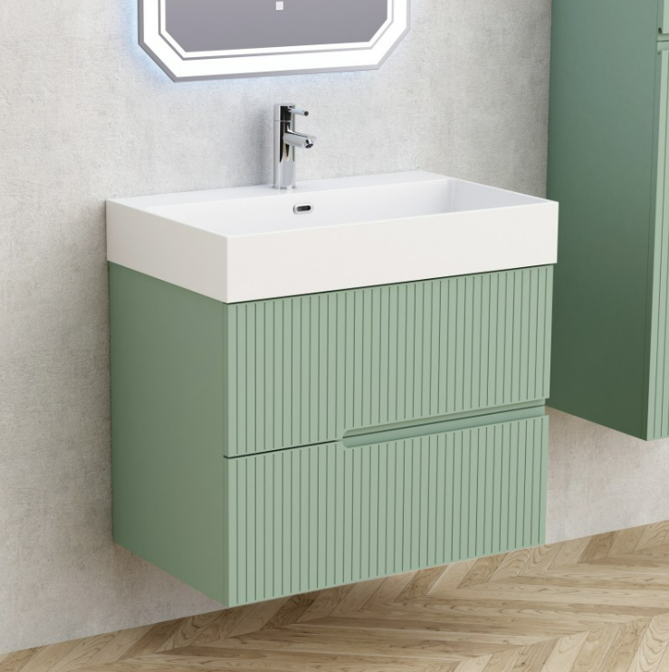 Wall-mounted green bathroom vanity with a white rectangular sink and chrome faucet; vertical grooved doors and wooden floor.